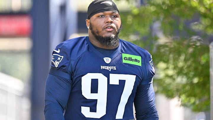 Jul 23, 2025; Foxborough, MA, USA; New England Patriots defensive end Milton Williams (97) walks to the practice field for training camp at Gillette Stadium. Mandatory Credit: Eric Canha-Imagn Images