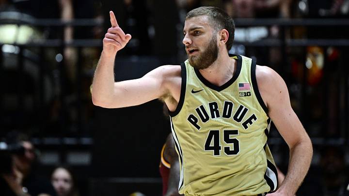 Purdue Boilermakers center Oscar Cluff (45) celebrates making a basket.