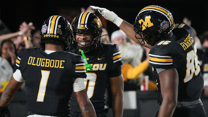 Missouri Tigers wide receiver Joshua Manning (0) celebrates with wide receiver Donovan Olugbode (1) and tight end Dakotah Terrell (85) after scoring against the Mississippi State Bulldogs during the first half of the game at Faurot Field at Memorial Stadium.