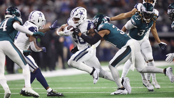 Dec 10, 2023; Arlington, Texas, USA; Dallas Cowboys running back Tony Pollard (20) is tackled by Philadelphia Eagles safety Kevin Byard (31) in the game at AT&T Stadium. Mandatory Credit: Tim Heitman-Imagn Images