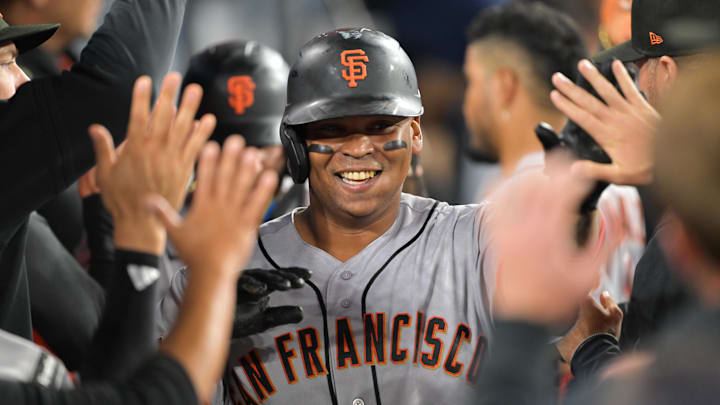 May 11, 2026; Los Angeles, California, USA; San Francisco Giants first baseman Rafael Devers (16) scores on a double by  left fielder Heliot Ramos (17) in the sixth inning against the Los Angeles Dodgers at Dodger Stadium. Mandatory Credit: Jayne Kamin-Oncea-Imagn Images