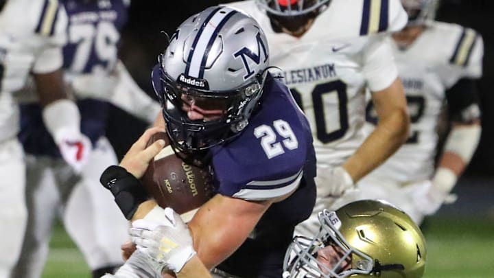 Salesianum's Jett Healy drags down Malvern Prep's Jake Bauer after a gain in the second half of Malvern Prep's 27-3 win at Abessinio Stadium, Friday, Sept. 20, 2024.