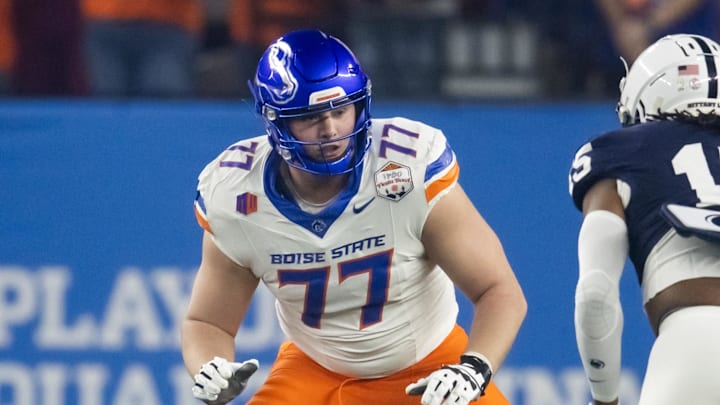 Dec 31, 2024; Glendale, AZ, USA; Boise State Broncos offensive tackle Kage Casey (77) against the Penn State Nittany Lions during the Fiesta Bowl at State Farm Stadium. Mandatory Credit: Mark J. Rebilas-Imagn Images