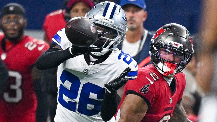 Dallas Cowboys cornerback Daron Bland (26) attempts but cannot intercept a pass intended for Tampa Bay Buccaneers wide receiver Emeka Egbuka (2) during the game between the Cowboys and the Buccaneers at AT&T Stadium. Mandatory Credit: Jerome Miron-Imagn Images