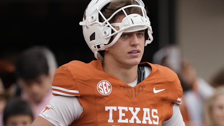 Texas Longhorns quarterback Arch Manning (16) pauses while warming up before a game against the Vanderbilt Commodores at Darrell K Royal-Texas Memorial Stadium.
