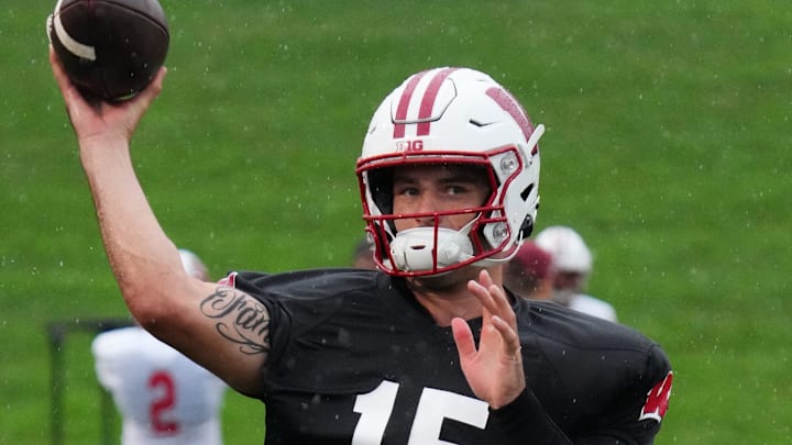 Wisconsin quarterback Hunter Simmons (15) throws downfield during football practice Wednesday, July 30, 2025, at Ralph E. Davis Pioneer Stadium in Platteville, Wisconsin.