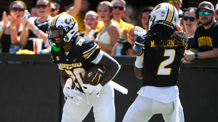 Sept 13, 2025; Columbia, Missouri, USA; Missouri Tigers running back Jamal Roberts (20) and wide receiver Marquis Johnson (2) celebrate a Roberts' touchdown against the Louisiana Ragin' Cajuns at Faurot Field. Sept 13, 2025; Columbia, Missouri, USA; Missouri Tigers running back Jamal Roberts (20) and wide receiver Marquis Johnson (2) celebrate a Roberts' touchdown against the Louisiana Ragin' Cajuns at Faurot Field.