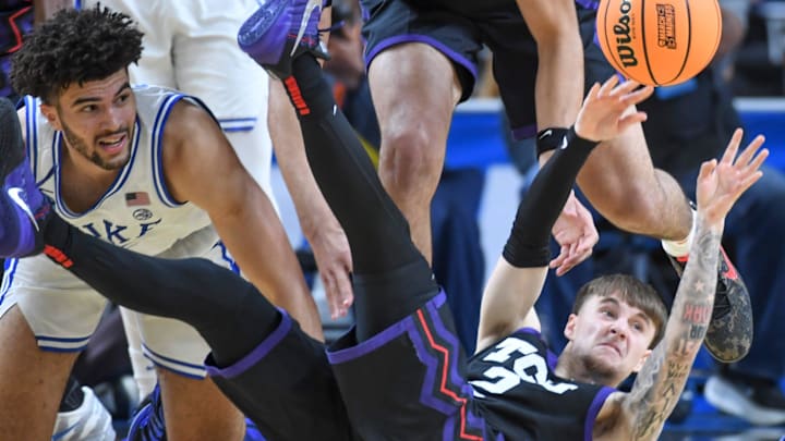 TCU Horned Frogs guard Brock Harding (2) passes the ball while falling to the court Saturday, March 21, 2026, during the NCAA Men’s Basketball Tournament second round game against the Duke Blue Devils at Bon Secours Wellness Arena in Greenville, South Carolina. TCU Horned Frogs guard Brock Harding (2) passes the ball while falling to the court Saturday, March 21, 2026, during the NCAA Men’s Basketball Tournament second round game against the Duke Blue Devils at Bon Secours Wellness Arena in Greenville, South Carolina.