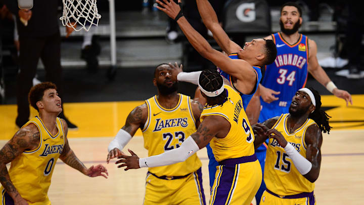Feb 10, 2021; Los Angeles, California, USA; Oklahoma City Thunder forward Darius Bazley (7) plays for the ball against Los Angeles Lakers guard Wesley Matthews (9) forward LeBron James (23) forward Kyle Kuzma (0) and center Montrezl Harrell (15) during the second half at Staples Center. Mandatory Credit: Gary A. Vasquez-Imagn Images Feb 10, 2021; Los Angeles, California, USA; Oklahoma City Thunder forward Darius Bazley (7) plays for the ball against Los Angeles Lakers guard Wesley Matthews (9) forward LeBron James (23) forward Kyle Kuzma (0) and center Montrezl Harrell (15) during the second half at Staples Center. Mandatory Credit: Gary A. Vasquez-Imagn Images