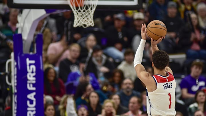 Mar 19, 2025; Salt Lake City, Utah, USA;  Washington Wizards guard Colby Jones (1) attempts a free throw against the Utah Jazz during the second half at the Delta Center. Mandatory Credit: Peter Creveling-Imagn Images