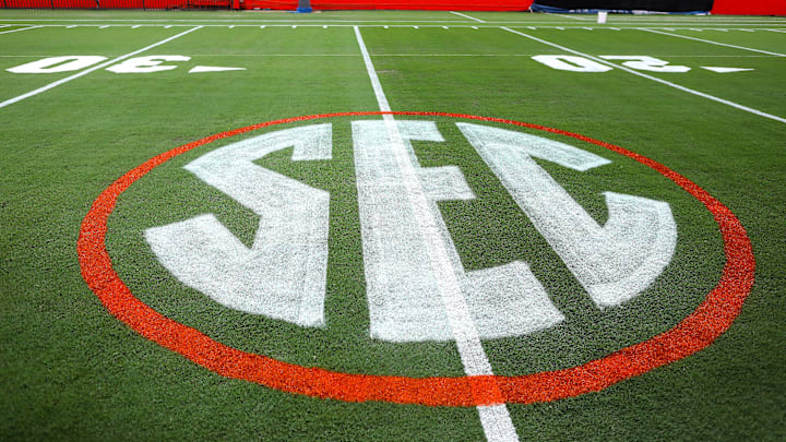 The SEC logo has a first coat of paint on the field at Ben Hill Griffin Stadium as the grounds crew