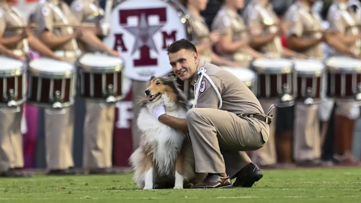 Oct 11, 2025; College Station, Texas, USA; Cadet Wilson Winchester takes a knee with Texas A&M Aggies mascot Reveille X prior to the game against the Florida Gators at Kyle Field. Mandatory Credit: Maria Lysaker-Imagn Images Oct 11, 2025; College Station, Texas, USA; Cadet Wilson Winchester takes a knee with Texas A&M Aggies mascot Reveille X prior to the game against the Florida Gators at Kyle Field. Mandatory Credit: Maria Lysaker-Imagn Images
