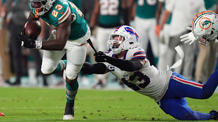 Sep 12, 2024; Miami Gardens, Florida, USA; Buffalo Bills linebacker Terrel Bernard (43) reaches for Miami Dolphins running back Jeff Wilson Jr. (23) 