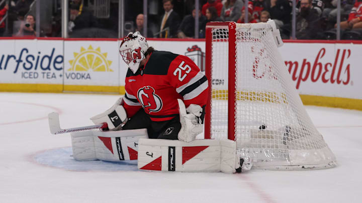 Dec 5, 2025; Newark, New Jersey, USA; Vegas Golden Knights defenseman Shea Theodore (27) (not shown) scores a goal on New Jersey Devils goaltender Jacob Markstrom (25) during the first period at Prudential Center. Mandatory Credit: Ed Mulholland-Imagn Images
