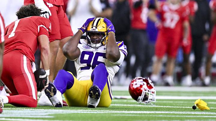 Dec 27, 2025; Houston, TX, USA; Louisiana State Tigers defensive tackle Dominick McKinley (96) reacts after tackling Houston Cougars quarterback Conner Weigman (1) during the first half at NRG Stadium. Mandatory Credit: Maria Lysaker-Imagn Images Dec 27, 2025; Houston, TX, USA; Louisiana State Tigers defensive tackle Dominick McKinley (96) reacts after tackling Houston Cougars quarterback Conner Weigman (1) during the first half at NRG Stadium. Mandatory Credit: Maria Lysaker-Imagn Images
