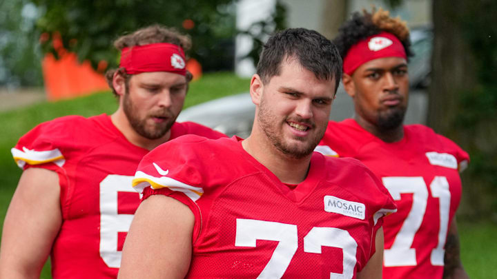 Jul 22, 2025; St. Joseph, MO, USA; Kansas City Chiefs offensive tackles Dalton Cooper (73) and Josh Simmons (71) walk down the hill to the practice fields during training camp at Missouri Western State University. Mandatory Credit: Denny Medley-Imagn Images