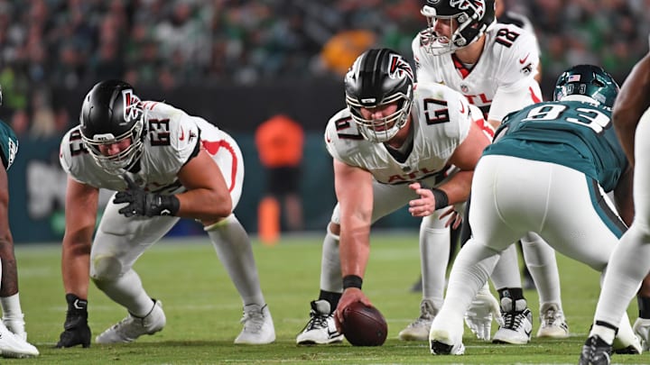 Sep 16, 2024; Philadelphia, Pennsylvania, USA; Atlanta Falcons guard Chris Lindstrom (63) and center Drew Dalman (67) lineup with quarterback Kirk Cousins (18) against the Philadelphia Eagles at Lincoln Financial Field.