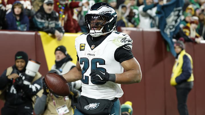 Dec 20, 2025; Landover, Maryland, USA; Philadelphia Eagles running back Saquon Barkley (26) celebrates after scoring a touchdown against the Washington Commanders in the second half at Northwest Stadium.