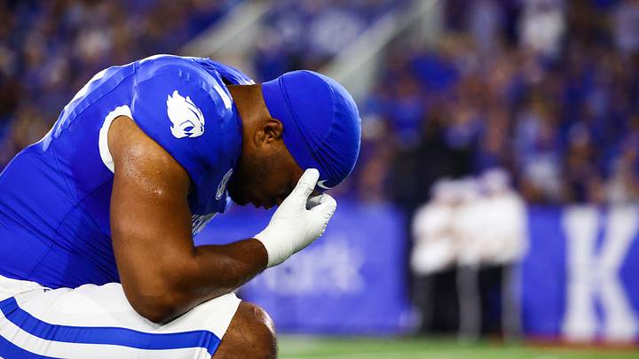 Aug 31, 2024; Lexington, Kentucky, USA; Kentucky Wildcats linebacker Jamon Dumas-Johnson (2) takes a knee before the start of the game at Kroger Field. Mandatory Credit: Carter Skaggs-USA TODAY Sports