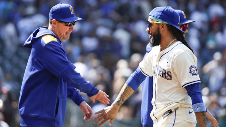 Seattle Mariners shortstop J.P. Crawford (right) celebrates with manager Dan Wilson after a win against the Cleveland Guardians on June 15 at T-Mobile Park.
