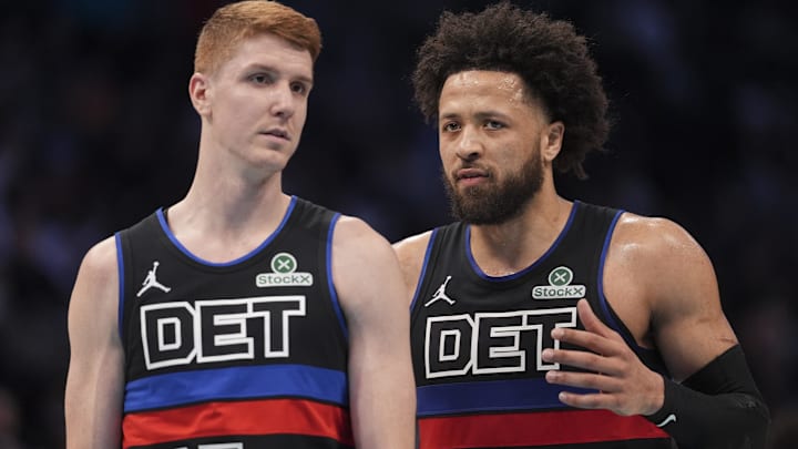Feb 9, 2026; Charlotte, North Carolina, USA; Detroit Pistons guard Cade Cunningham (2) talks with guard Kevin Huerter (27) as he enters the game against the Charlotte Hornets during the second quarter at Spectrum Center.