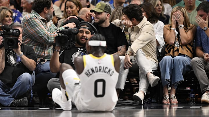 Oct 28, 2024; Dallas, Texas, USA; Fans react and turn away from looking at the leg injury suffered by Utah Jazz forward Taylor Hendricks (0) during the second half against the Dallas Mavericks at the American Airlines Center. Mandatory Credit: Jerome Miron-Imagn Images