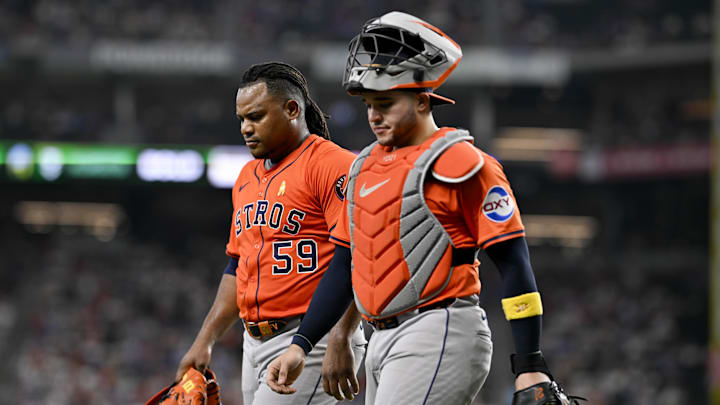 Sep 7, 2025; Arlington, Texas, USA; Houston Astros starting pitcher Framber Valdez (59) and catcher Yainer Diaz (21) come off the field during the game against the Texas Rangers at Globe Life Field. Mandatory Credit: Jerome Miron-Imagn Images