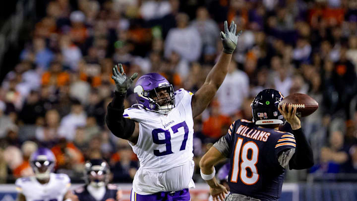 Vikings DT Javon Hargrave chases Bears quarterback Caleb Williams at Soldier Field. 