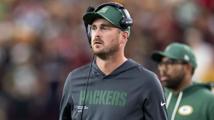 Oct 19, 2025; Glendale, Arizona, USA; Green Bay Packers quarterbacks coach Sean Mannion against the Arizona Cardinals at State Farm Stadium. Mandatory Credit: Mark J. Rebilas-Imagn Images