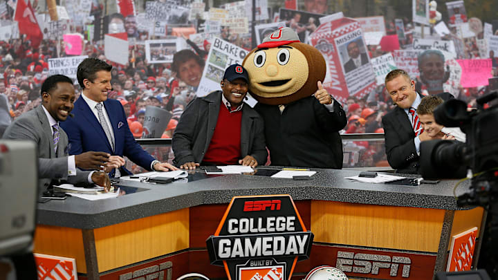 Lee Corso gives the thumbs up after picking Ohio State to win while, from left, Desmond Howard, Rece Davis, Archie Griffin, and Kirk Herbstreit sit on the set of ESPN's College GameDay broadcast from the campus of Ohio State prior to the NCAA football game against the Michigan State Spartans in Columbus on Nov. 21, 2015. (Adam Cairns / The Columbus Dispatch)