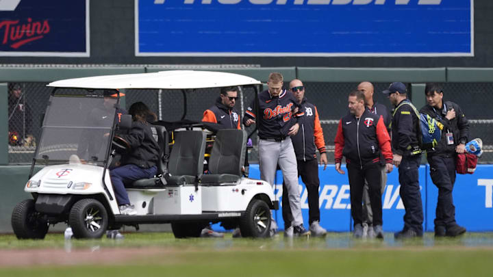 Detroit Tigers center fielder Parker Meadows (22) enters a cart after he collided with left fielder Riley Greene (31) on a fly ball. 