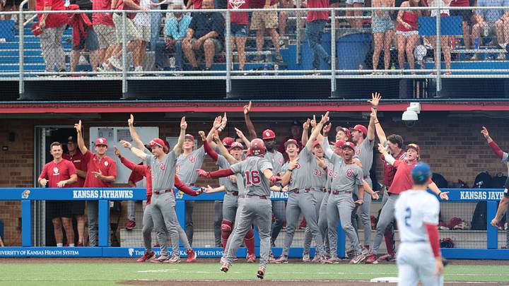 Oklahoma Sooners Dayton Tockey (16) yells out to the dugout after hitting a home run against Kansas Jayhawks during the NCAA Lawrence Super Regional game at Hoglund Ballpark on June 6, 2026. Oklahoma Sooners Dayton Tockey (16) yells out to the dugout after hitting a home run against Kansas Jayhawks during the NCAA Lawrence Super Regional game at Hoglund Ballpark on June 6, 2026.