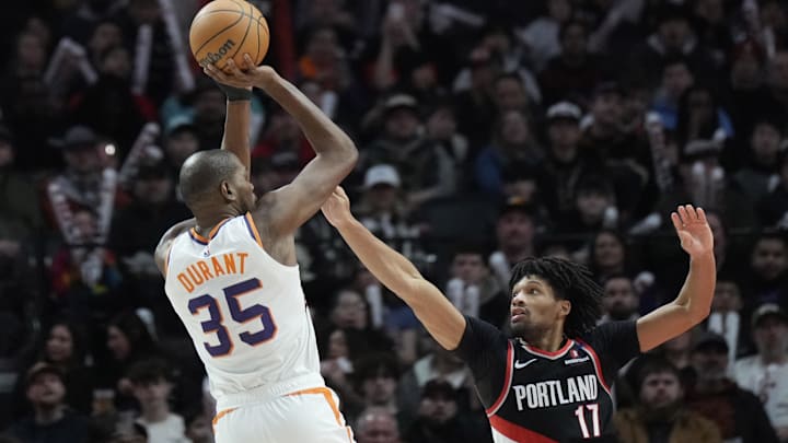 Feb 1, 2025; Portland, Oregon, USA; Phoenix Suns power forward Kevin Durant (35) shoots the ball over Portland Trail Blazers shooting guard Shaedon Sharpe (17) during the second half at Moda Center. Mandatory Credit: Soobum Im-Imagn Images