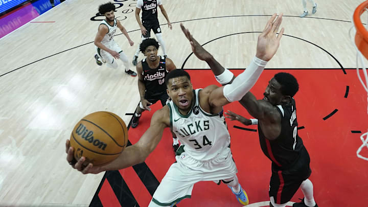 Jan 28, 2025; Portland, Oregon, USA; Milwaukee Bucks power forward Giannis Antetokounmpo (34) drives to the basket against Portland Trail Blazers center Deandre Ayton (2) during the second half at Moda Center. Mandatory Credit: Soobum Im-Imagn Images