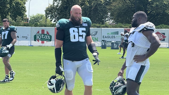 Lane Johnson and Moro Ojomo discuss a drill during Eagles training camp. Lane Johnson and Moro Ojomo discuss a drill during Eagles training camp.