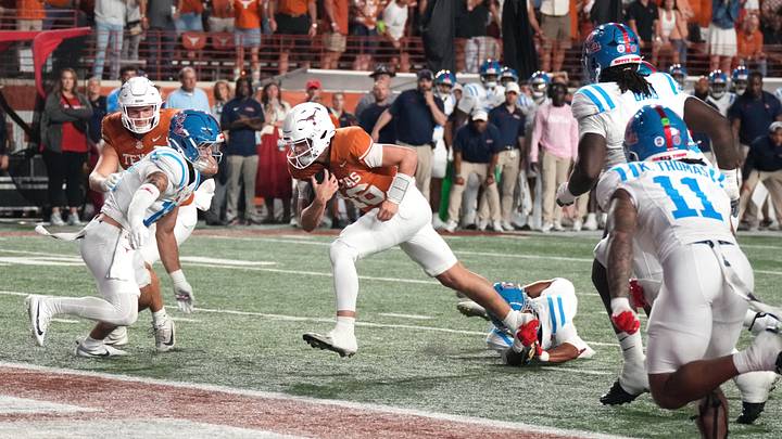 Texas Longhorns quarterback Arch Manning scores a rushing touchdown during the first half against the Mississippi Rebels at Darrell K Royal-Texas Memorial Stadium.  Mandatory Credit: Scott Wachter-Imagn Images