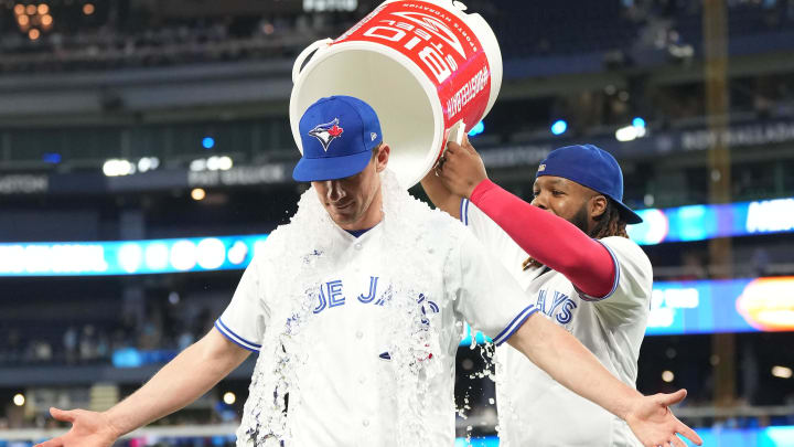 May 12, 2023; Toronto, Ontario, CAN; Toronto Blue Jays first baseman Vladimir Guerrero Jr. (27) pours the ice bucket on Toronto Blue Jays starting pitcher Chris Bassitt (40) at the end of the  the ninth inning at Rogers Centre. Mandatory Credit: Nick Turchiaro-USA TODAY Sports