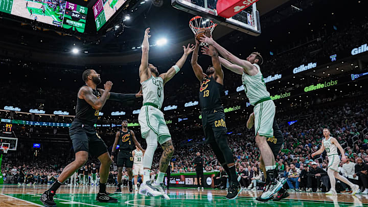 May 9, 2024; Boston, Massachusetts, USA; Cleveland Cavaliers center Tristan Thompson (13), Boston Celtics forward Jayson Tatum (0) and center Luke Kornet (40)1 work for the ball in the second half during game two of the second round for the 2024 NBA playoffs at TD Garden. Mandatory Credit: David Butler II-USA TODAY Sports