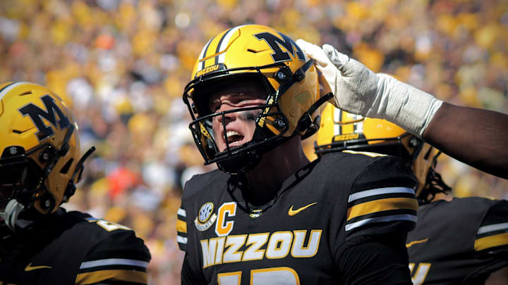 Oct 19, 2024; Columbia, Missouri, USA; Missouri Tigers quarterback Brady Cook (12) celebrates after his team scored a touchdown against the Auburn Tigers at Faurot Field at Memorial Stadium. Oct 19, 2024; Columbia, Missouri, USA; Missouri Tigers quarterback Brady Cook (12) celebrates after his team scored a touchdown against the Auburn Tigers at Faurot Field at Memorial Stadium.