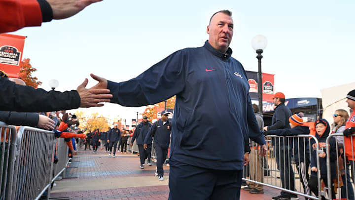 Nov 1, 2025; Champaign, Illinois, USA; Illinois Fighting Illini head coach Bret Bielema greets fans before an NCAA game against the Rutgers Scarlet Knights at Memorial Stadium. Mandatory Credit: Ron Johnson-Imagn Images Nov 1, 2025; Champaign, Illinois, USA; Illinois Fighting Illini head coach Bret Bielema greets fans before an NCAA game against the Rutgers Scarlet Knights at Memorial Stadium. Mandatory Credit: Ron Johnson-Imagn Images