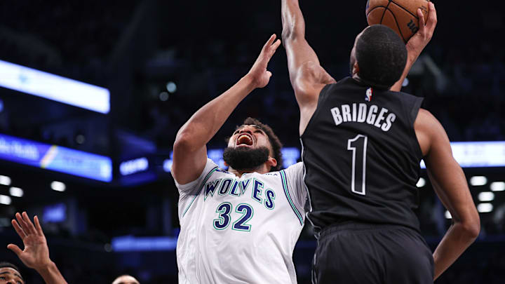 Jan 25, 2024; Brooklyn, New York, USA; Minnesota Timberwolves center Karl-Anthony Towns (32) drives for a shot against Brooklyn Nets forward Mikal Bridges (1) during the second half at Barclays Center. Mandatory Credit: Vincent Carchietta-Imagn Images