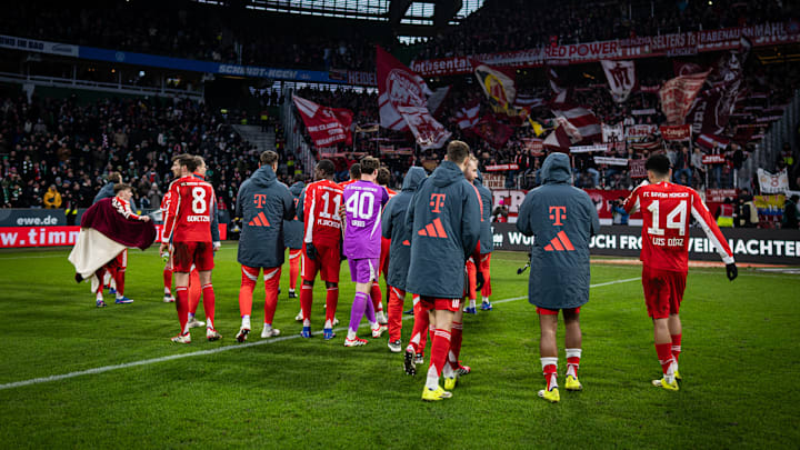 Bayern Munich players celebrating with fans after win against Werder Bremen.