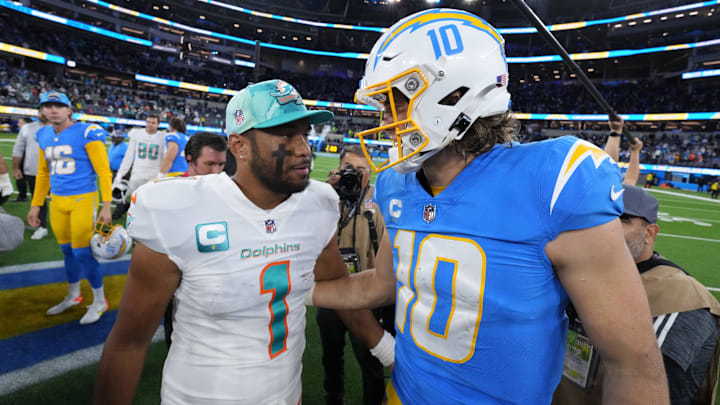 Miami Dolphins quarterback Tua Tagovailoa (1) and Los Angeles Chargers quarterback Justin Herbert (10) shake hands after the game at SoFi Stadium in 2022.