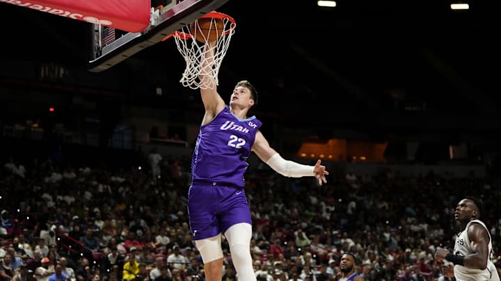 Jul 14, 2025; Las Vegas, NV, USA;  Utah Jazz forward Kyle Filipowski (22) dunks the ball against the San Antonio Spurs during the first half of a NBA basketball game at the Thomas & Mack Center. Mandatory Credit: Lucas Peltier-Imagn Images
