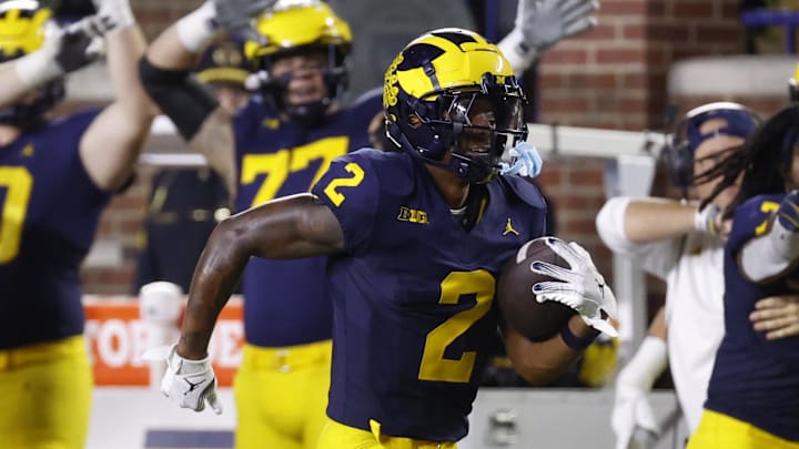 Aug 31, 2024; Ann Arbor, Michigan, USA; Michigan Wolverines defensive back Will Johnson (2) runs the ball after he makes an interception in the second half against the Fresno State Bulldogs at Michigan Stadium. Mandatory Credit: Rick Osentoski-Imagn Images Aug 31, 2024; Ann Arbor, Michigan, USA; Michigan Wolverines defensive back Will Johnson (2) runs the ball after he makes an interception in the second half against the Fresno State Bulldogs at Michigan Stadium. Mandatory Credit: Rick Osentoski-Imagn Images