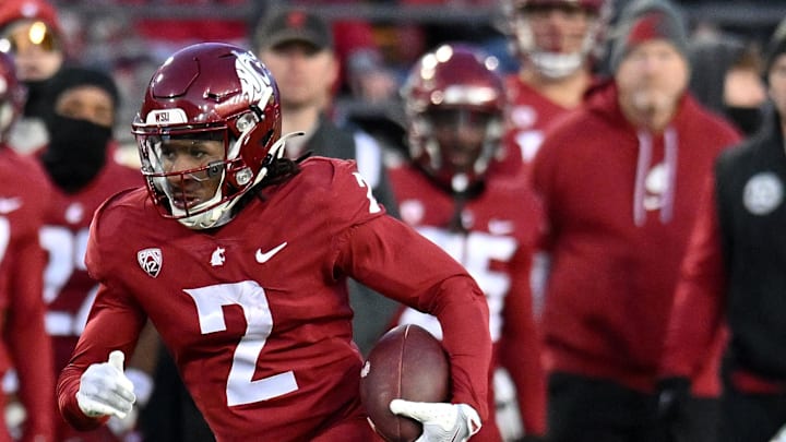 Nov 30, 2024; Pullman, Washington, USA; Washington State Cougars wide receiver Kyle Williams (2) carries the ball against the Wyoming Cowboys in the first half at Gesa Field at Martin Stadium. Mandatory Credit: James Snook-Imagn Images Nov 30, 2024; Pullman, Washington, USA; Washington State Cougars wide receiver Kyle Williams (2) carries the ball against the Wyoming Cowboys in the first half at Gesa Field at Martin Stadium. Mandatory Credit: James Snook-Imagn Images