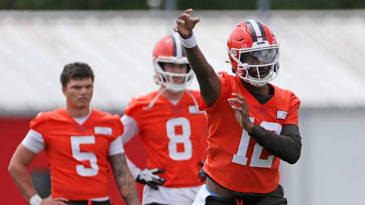 Browns quarterback Shedeur Sanders throws as QBs Dillon Gabriel (5) and Kenny Pickett look on during minicamp, Tuesday, June 10, 2025, in Berea.