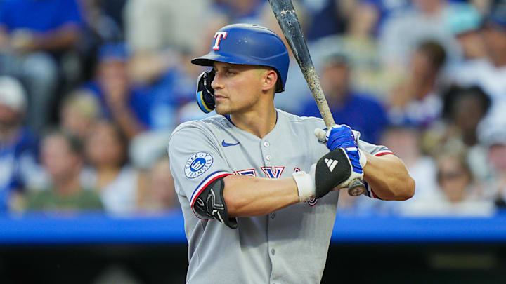 Aug 18, 2025; Kansas City, Missouri, USA; Texas Rangers shortstop Corey Seager (5) bats during the third inning against the Kansas City Royals at Kauffman Stadium. Mandatory Credit: Jay Biggerstaff-Imagn Images