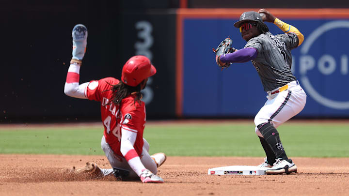 Jul 20, 2025; New York City, New York, USA;  New York Mets second baseman Luisangel Acuna (2) forces out Cincinnati Reds shortstop Elly De La Cruz (44) at second base and throws to first to complete the double play on a ball hit by designated hitter Austin Hays (12) (not pictured) during the first inning at Citi Field. Mandatory Credit: Vincent Carchietta-Imagn Images