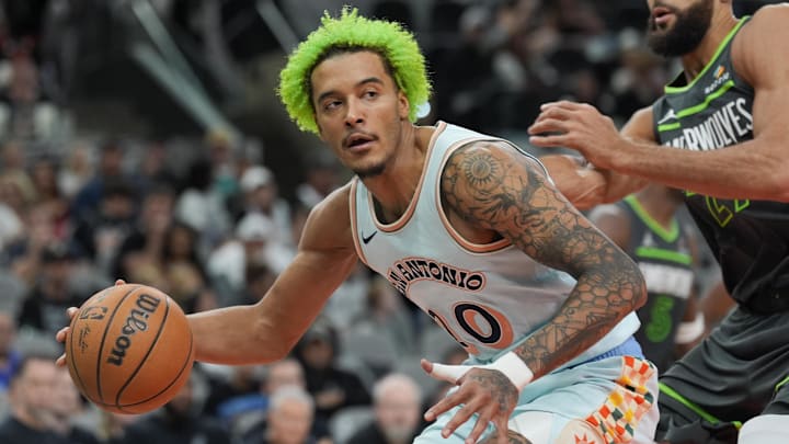 Dec 15, 2024; San Antonio, Texas, USA; San Antonio Spurs forward Jeremy Sochan (10) drives in against Minnesota Timberwolves center Rudy Gobert (27) in the second half at Frost Bank Center.